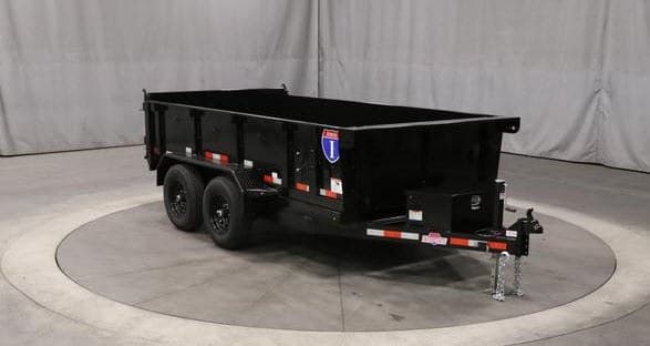 Florence Junk Removal's black dual-axle dump trailer